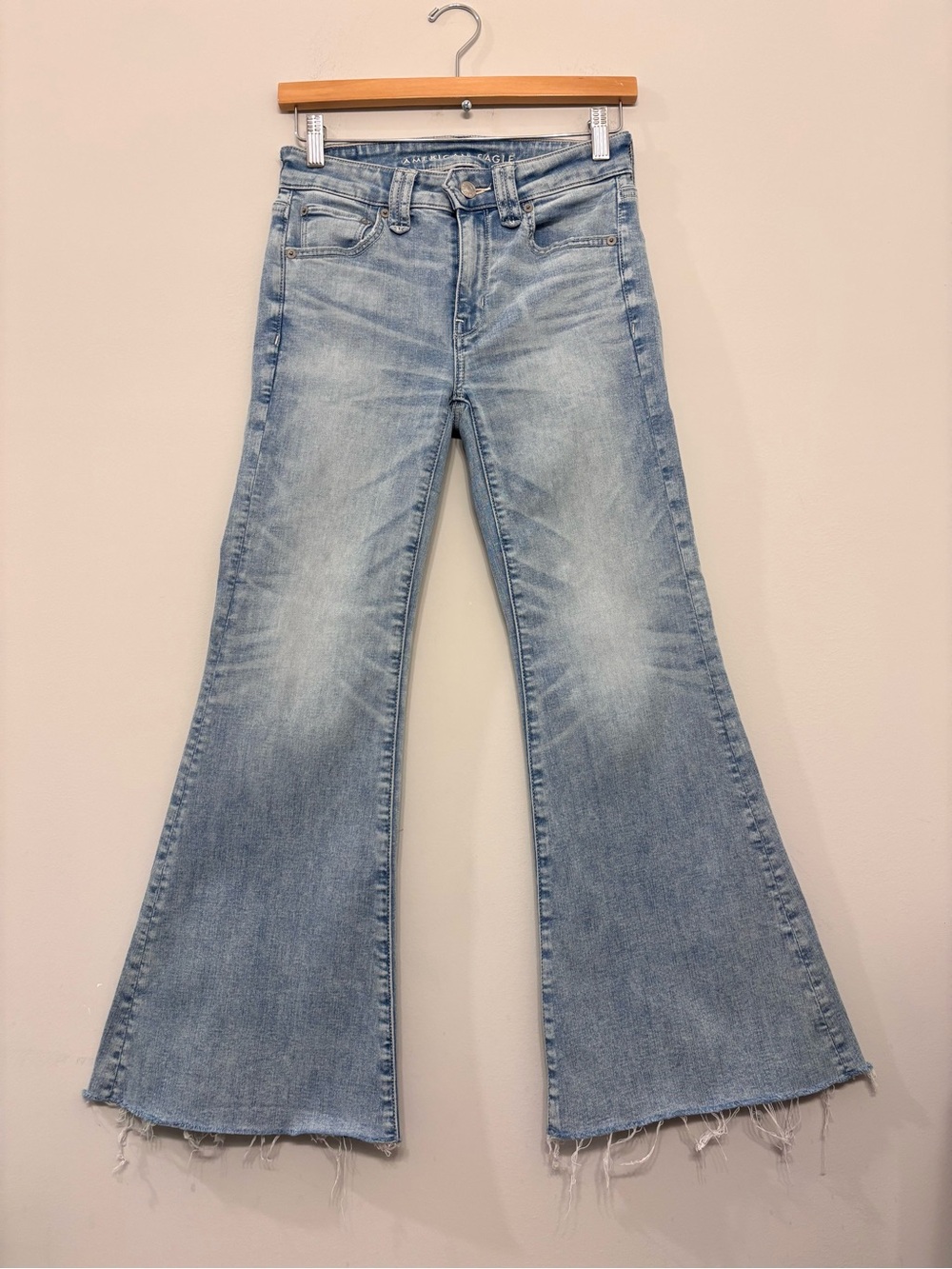 American Eagle Festival Flare Jeans Next Level Stretch Light Blue Raw Hem Size 2